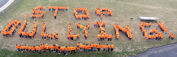 Middle school 6th grade students spell out Stop Bullying