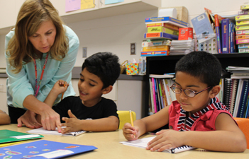 ESL teacher working with students