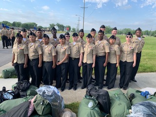 Photos of Students in uniform from Camp Perry, some wtih family and some with awards