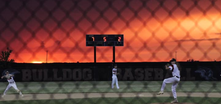 Baseball scoreboard and sunset