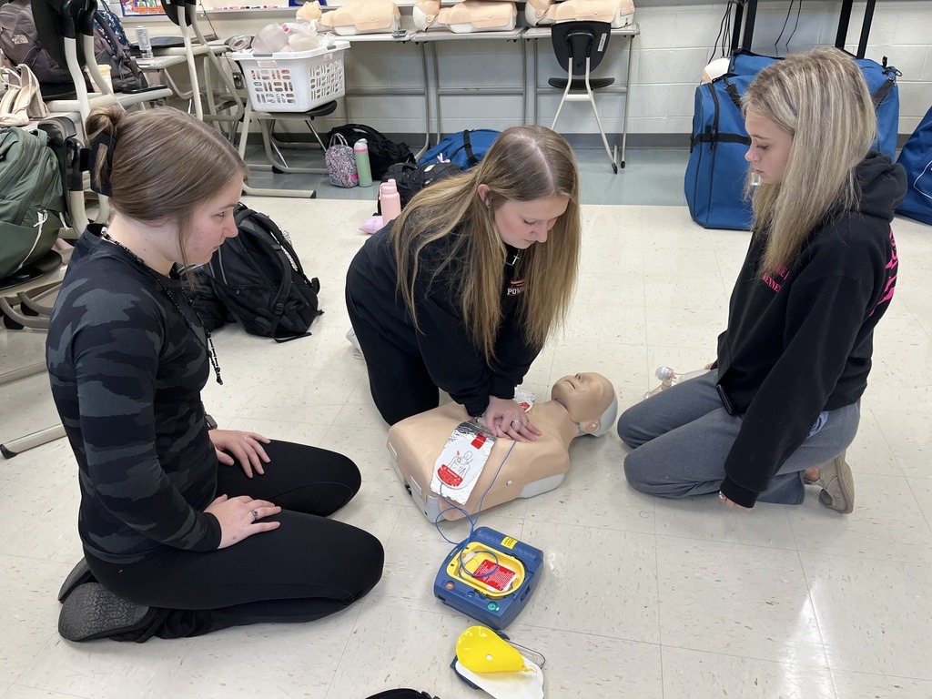 students learning CPR