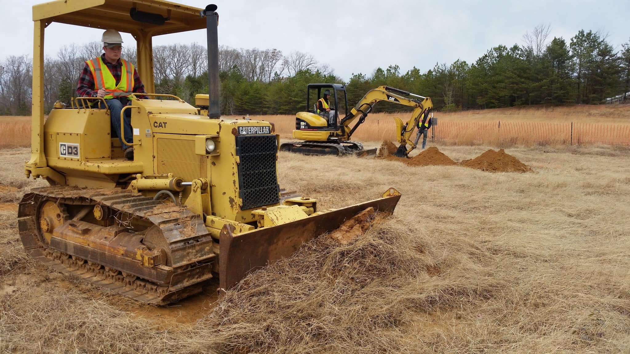 students operating tractors