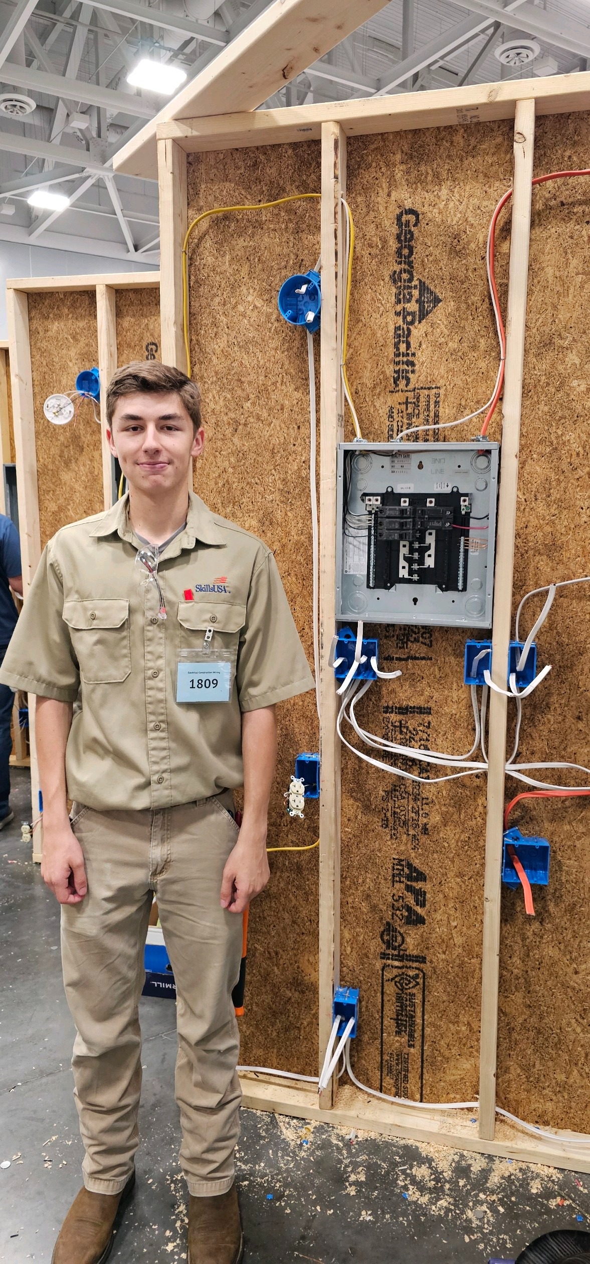 student beside electricity project