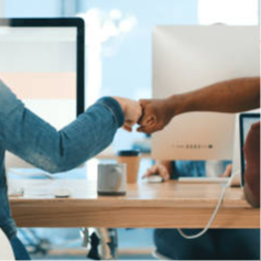 two people fist bumping each other