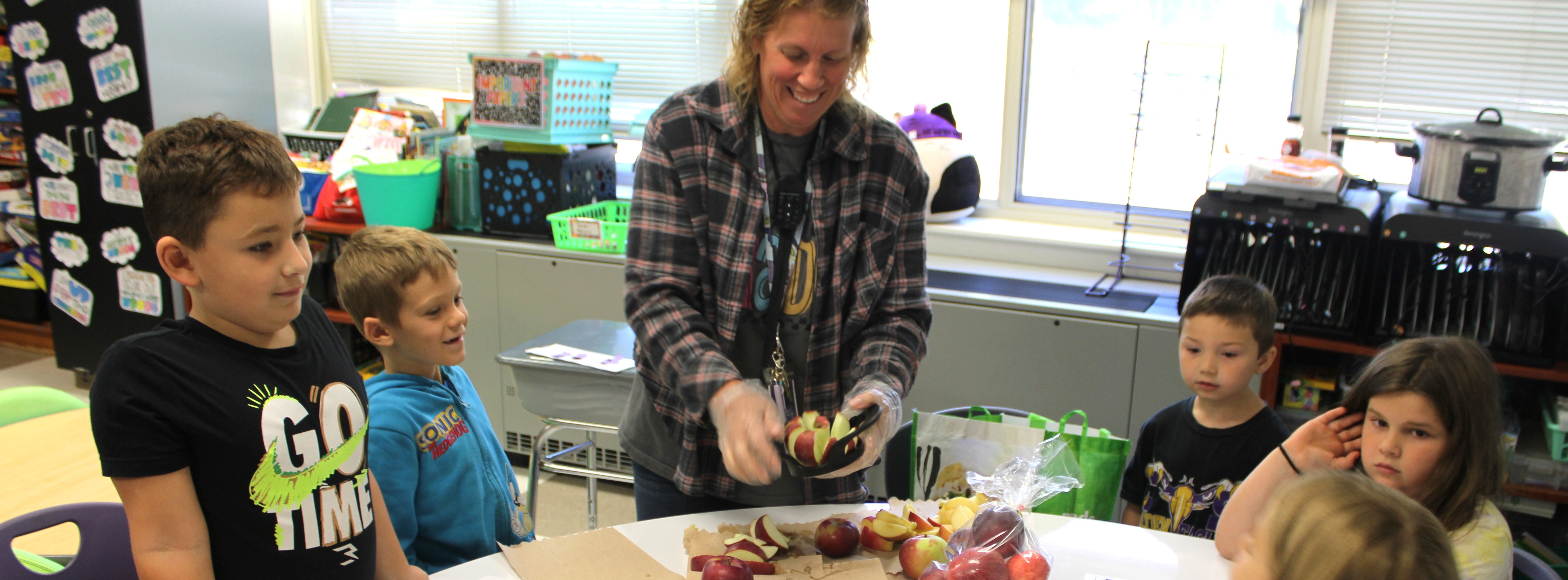Ms. Alford Preparing Apple Slices for Students