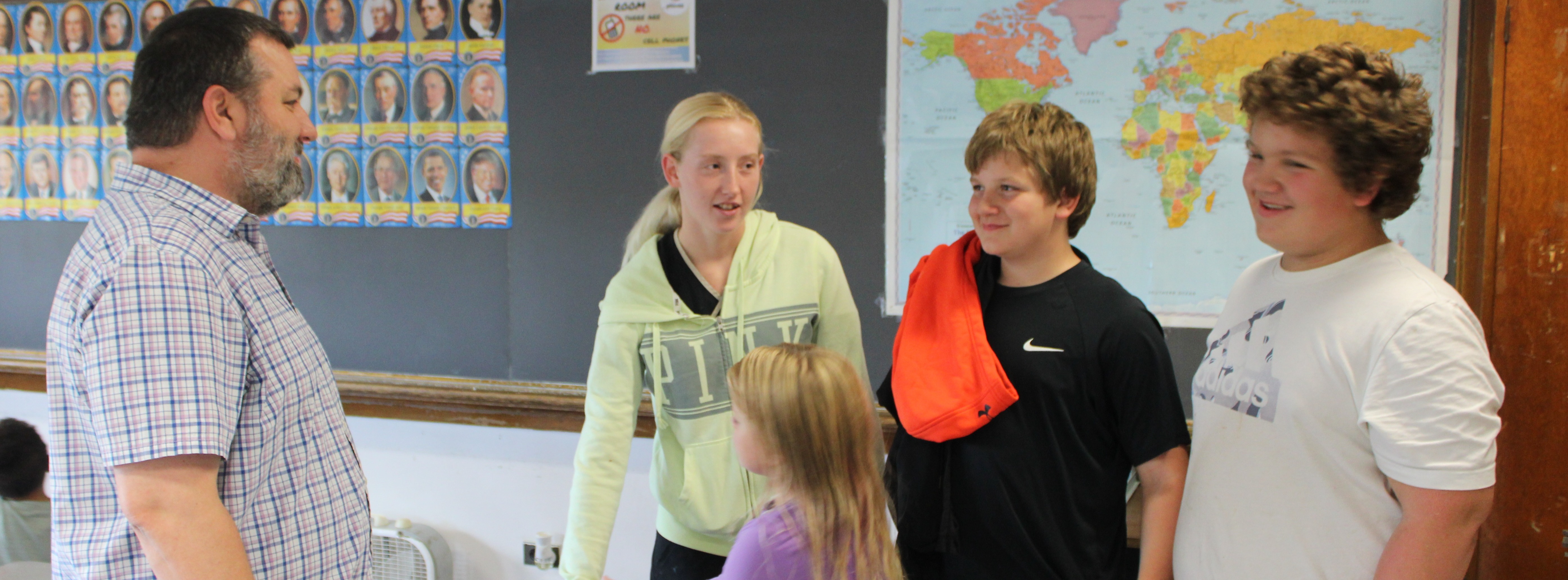 Students and parent with teacher at Open House