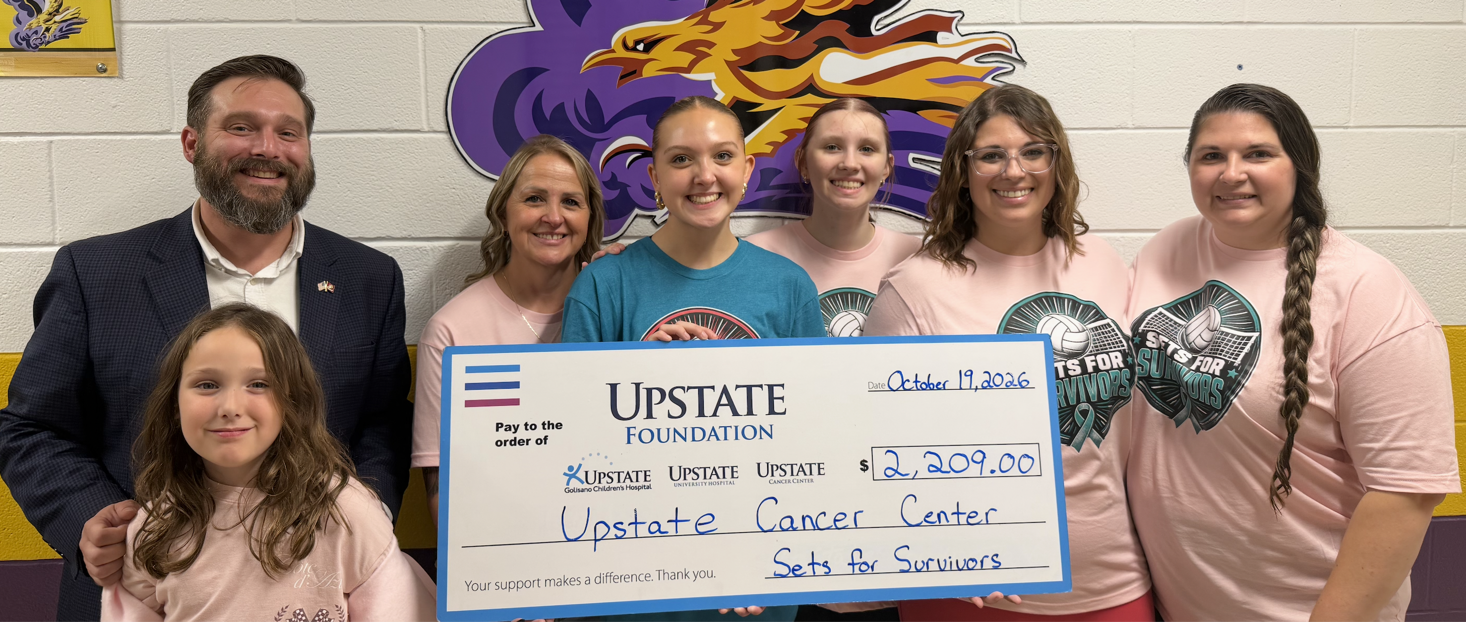 Volleyball Team Presents Check to Upstate University Hospital