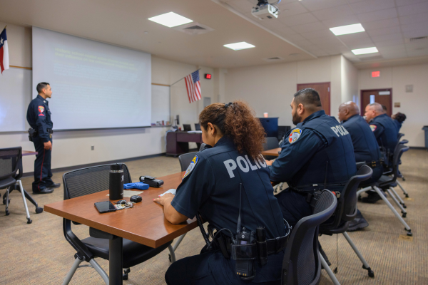 group of police officers in classroom setting 