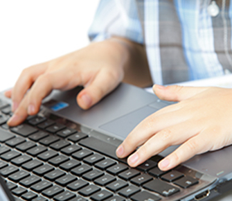 Person typing on a computer