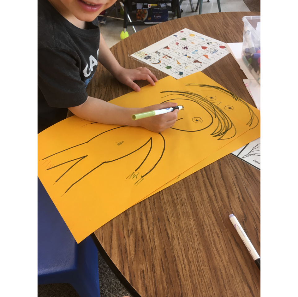 A student drawing a person