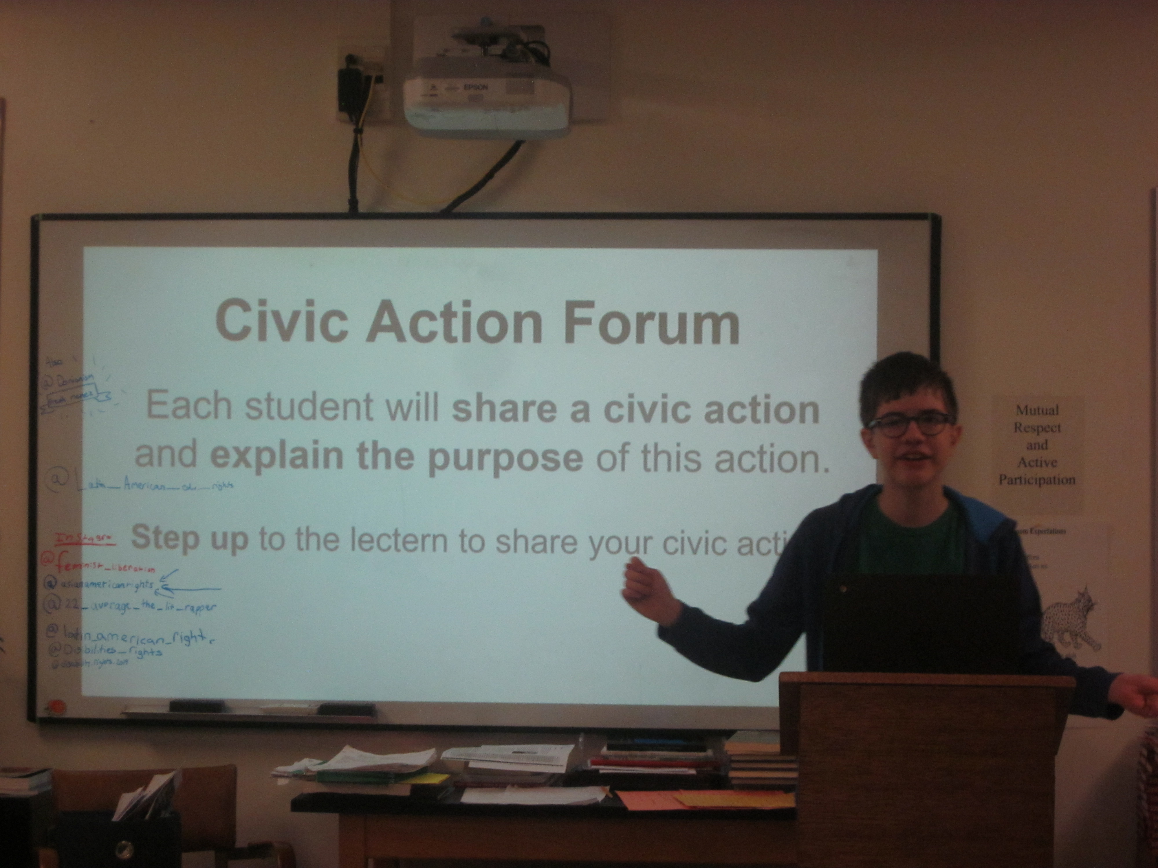 Student presents his civic action at a class forum