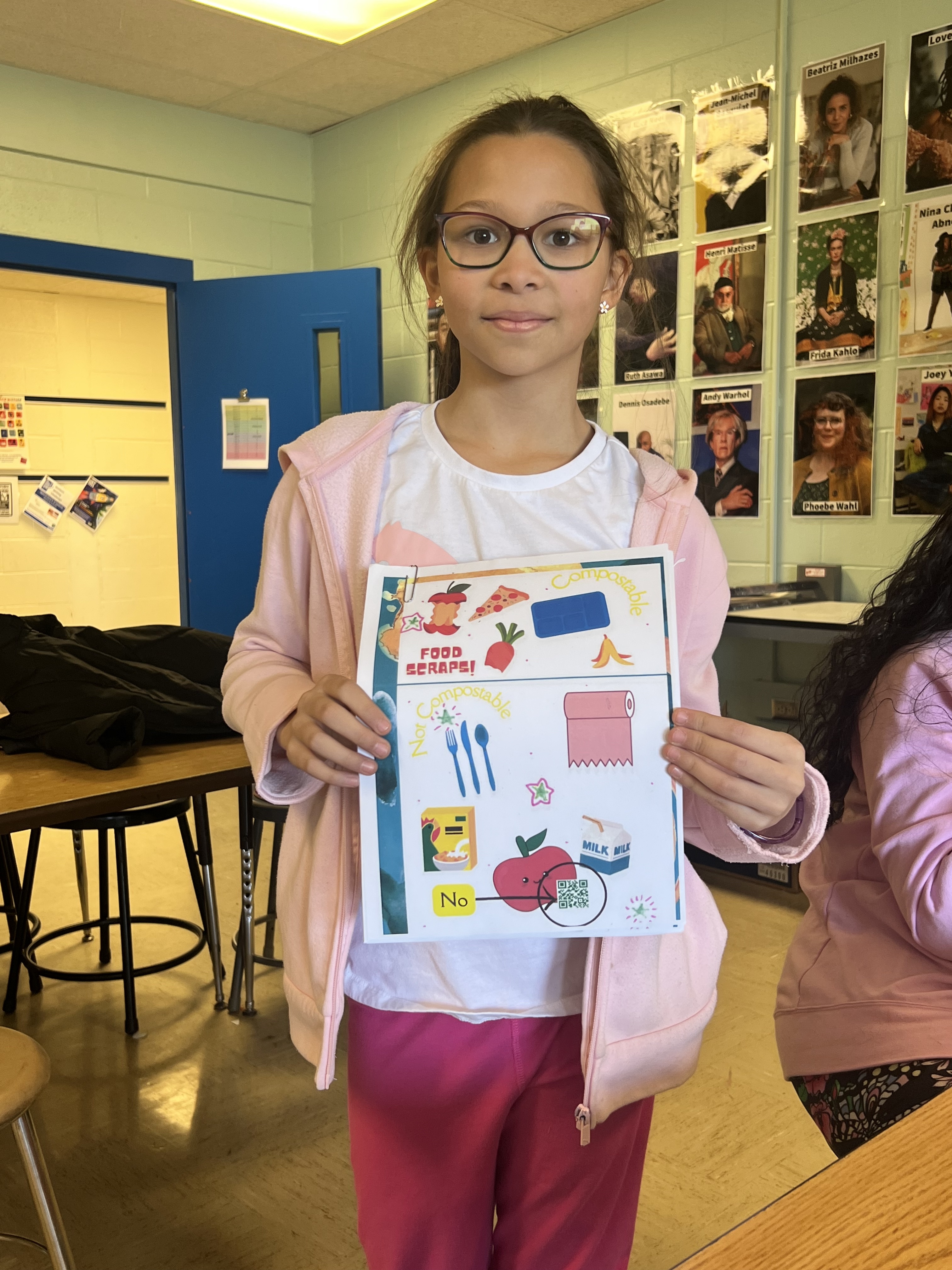 fifth grade student council member with a flyer she created