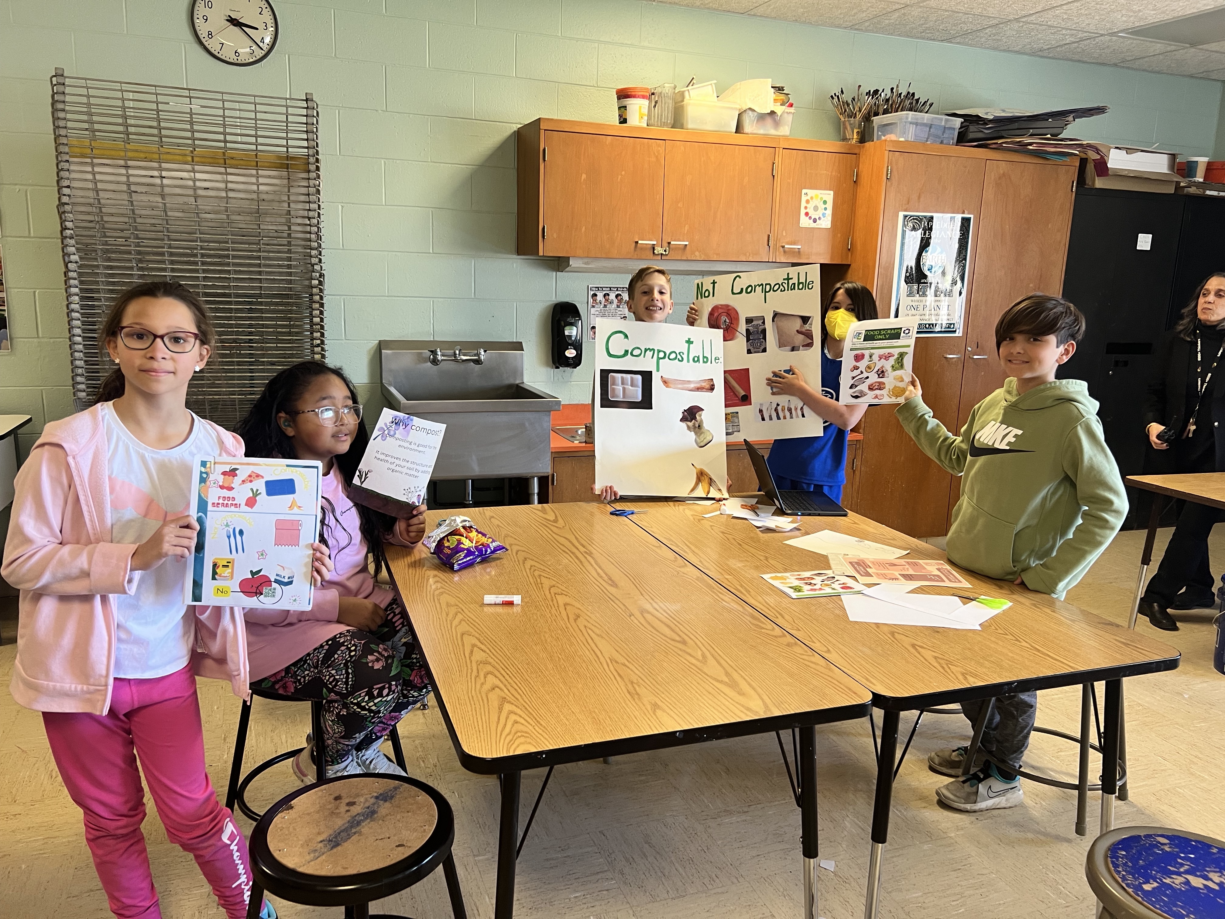 fifth grade student council members with posters and flyers