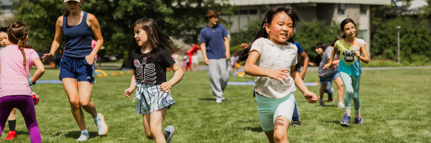 Students running across a field