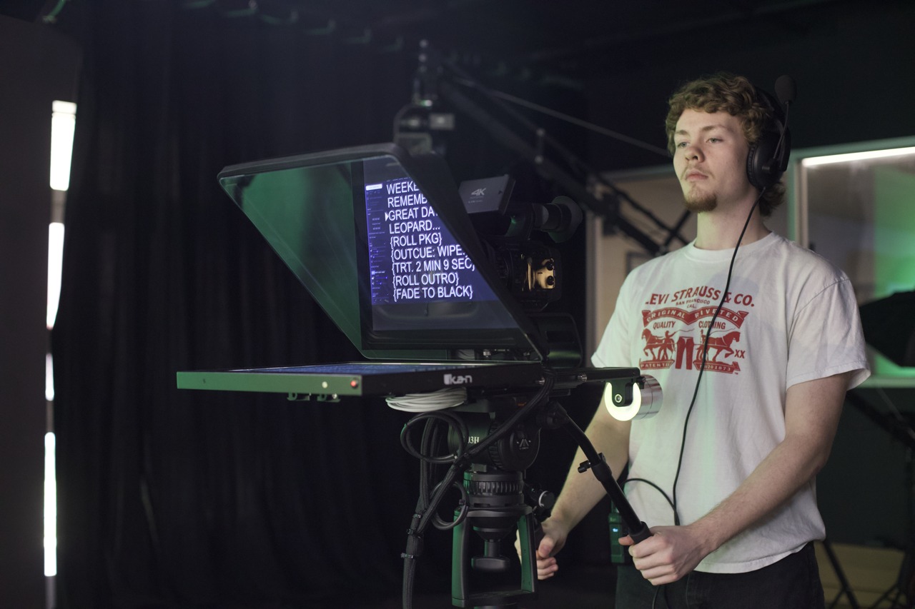 student with camera