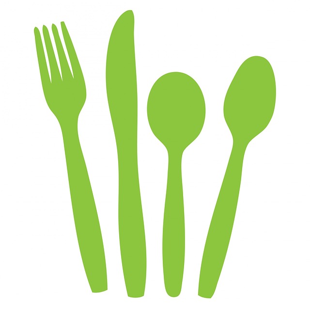 green fork, knife, small spoon and larger spoon