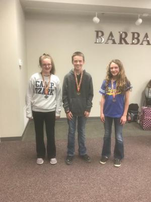 three kids with medals