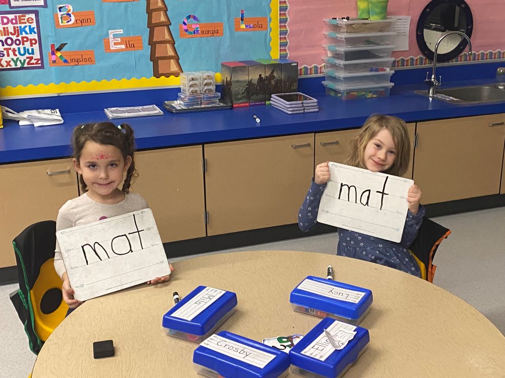 Kinders working on their writing