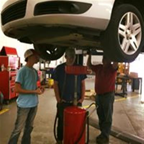 men fixing a car