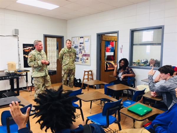 military men at a classroom