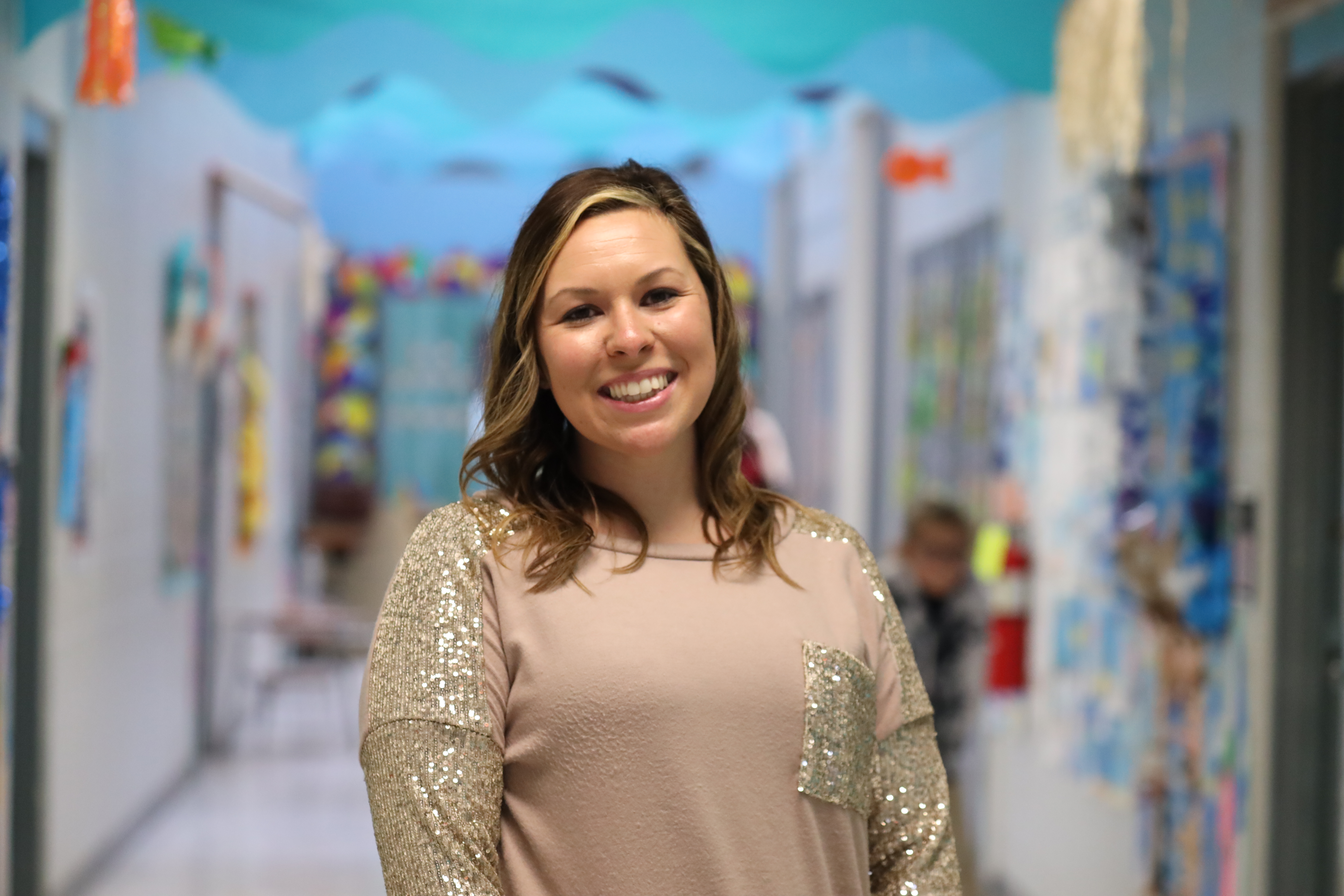 Megan Carney smiling in the hallway at Bovina Elementary School.