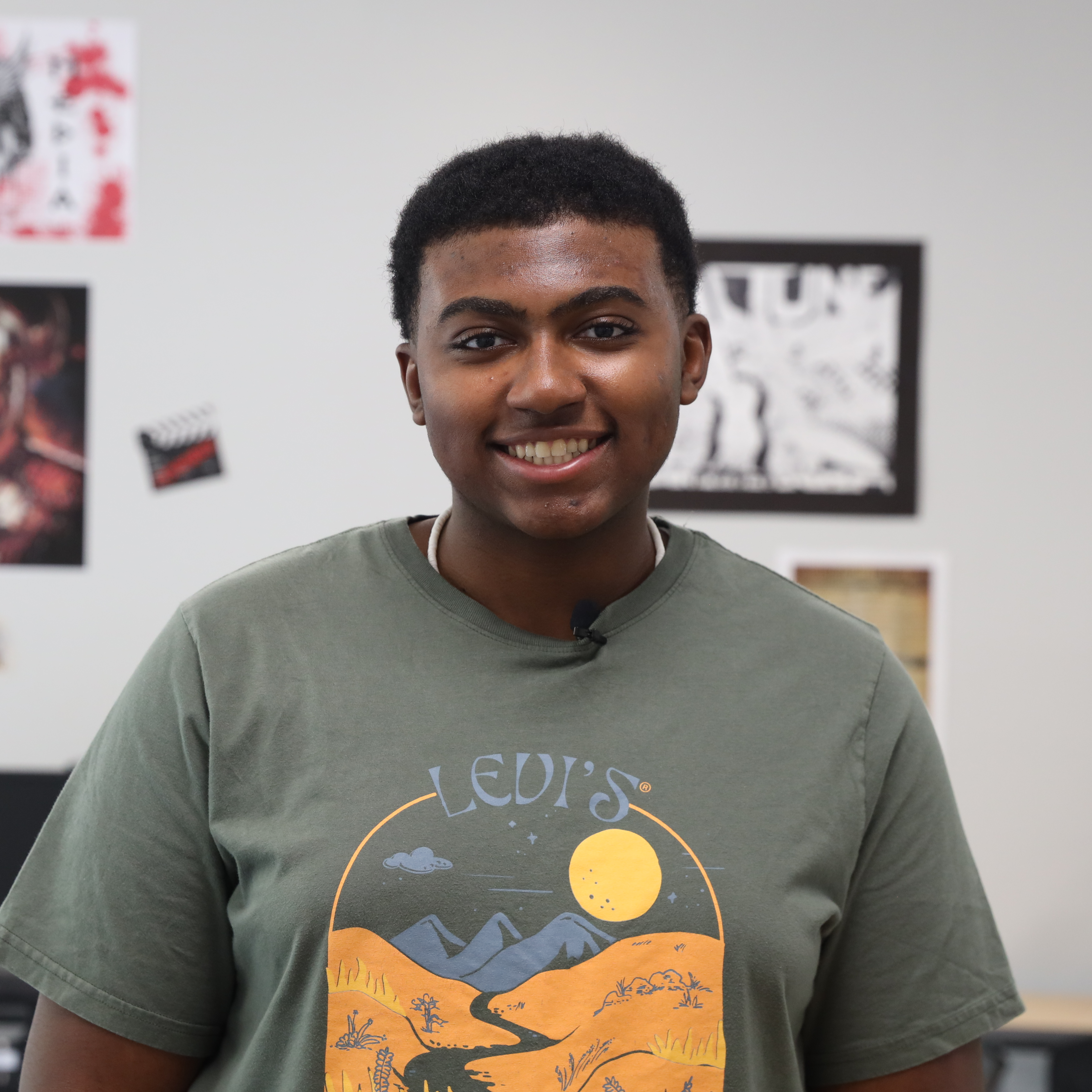 Paul Winfield smiling for a photo while standing inside of the production room at Warren Central High School.