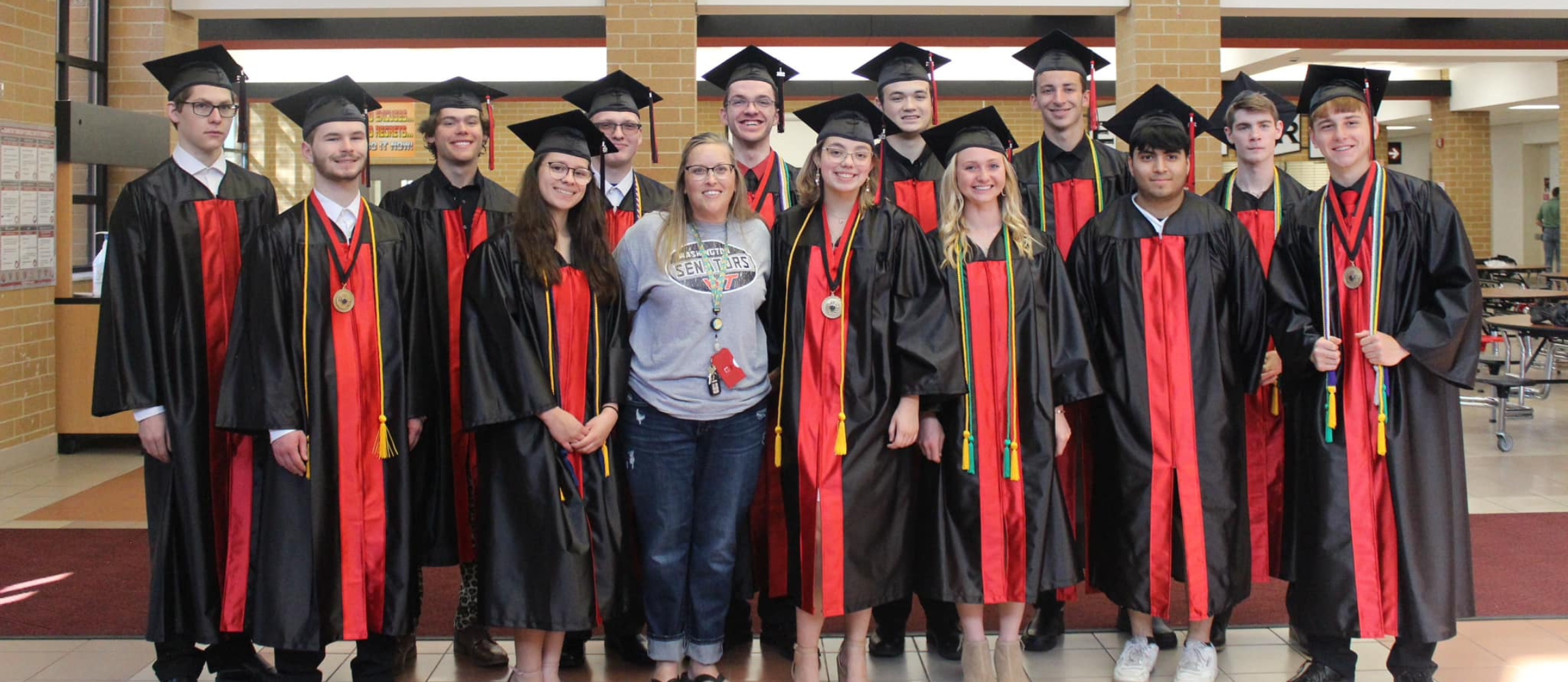 Group of students in graduates in cap and gown
