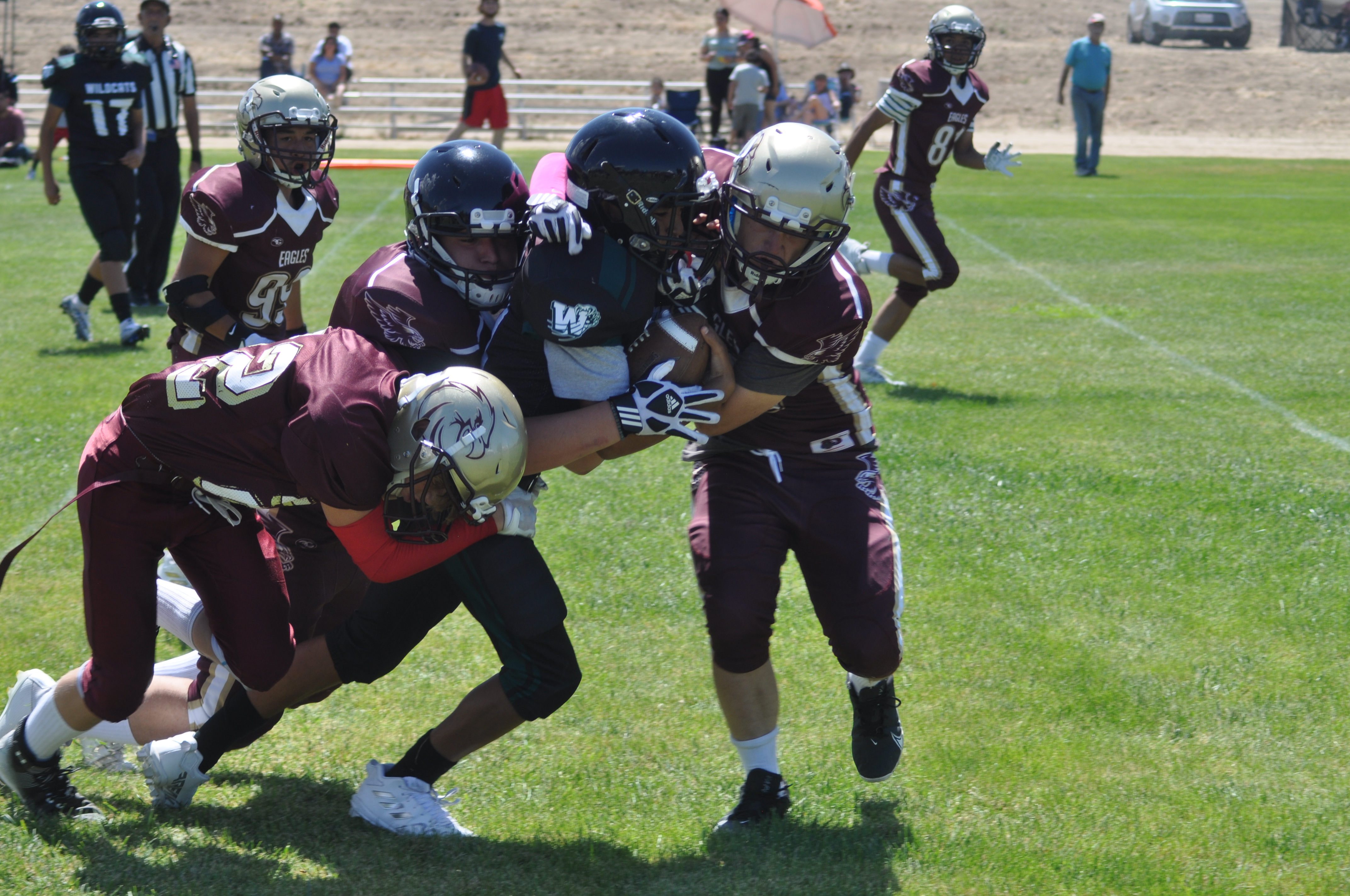 Julian High football players tackle the opposition.