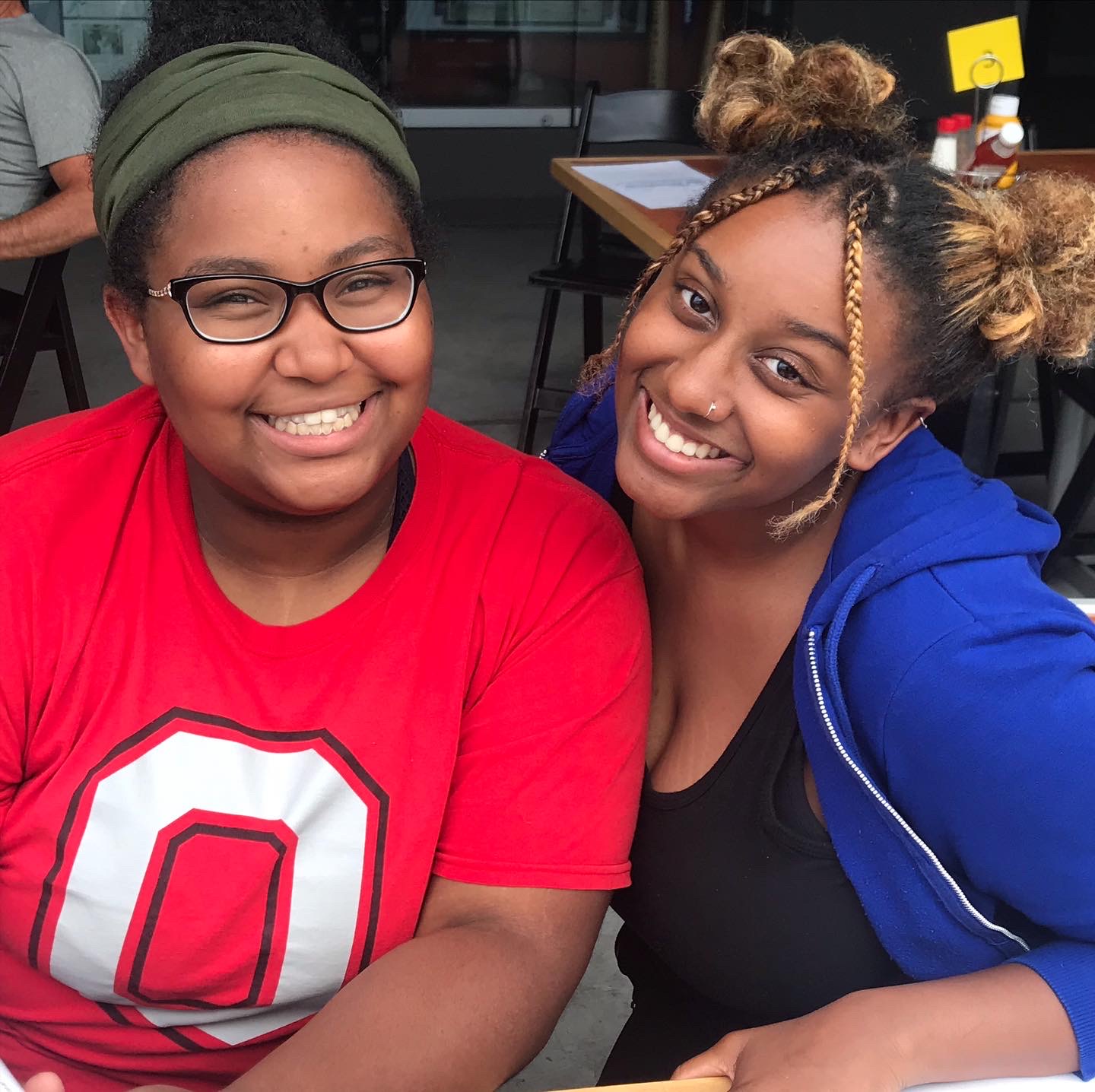 Two Black, female students are smiling.