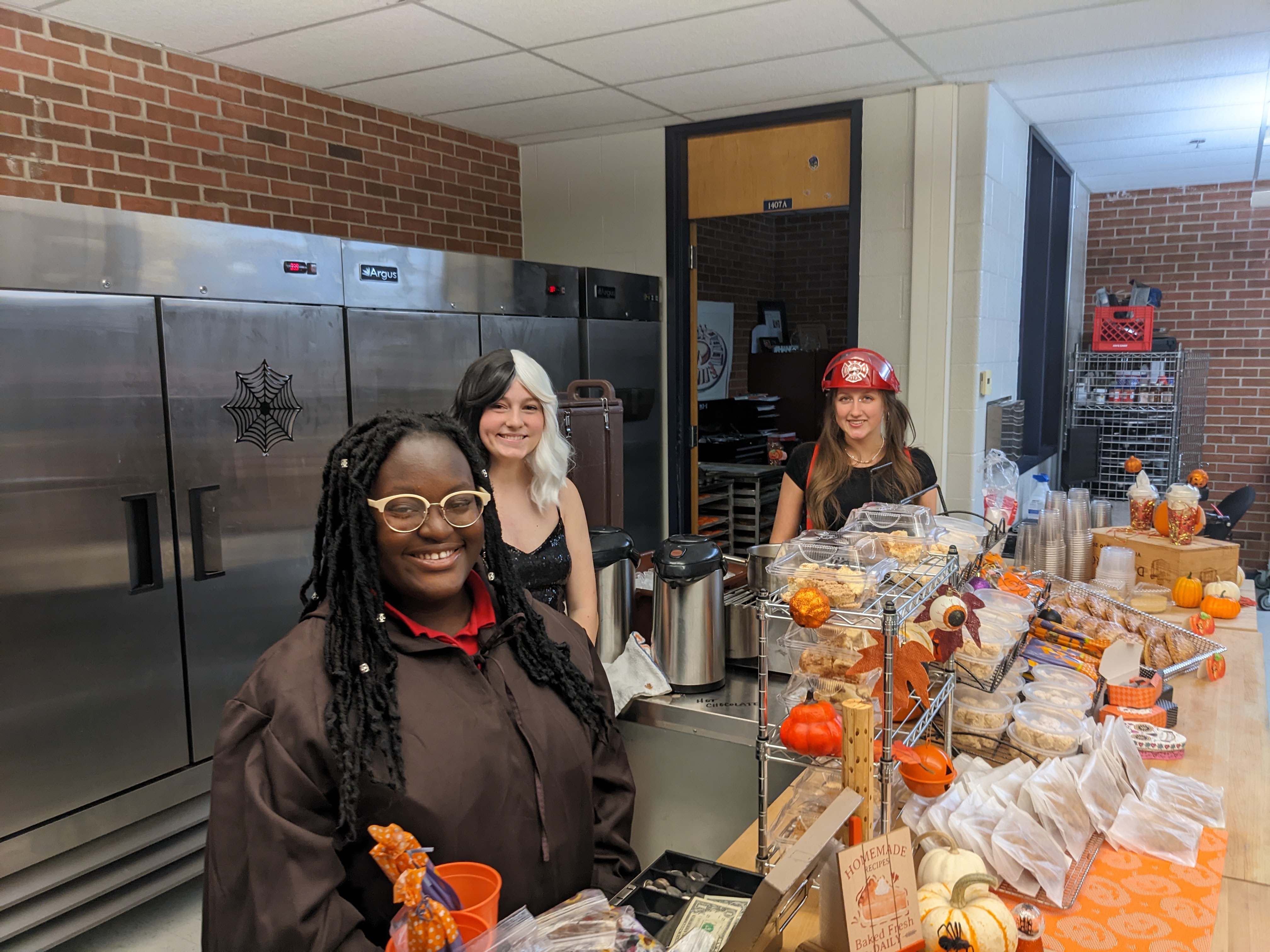The culinary students are in costume and in the spirit while making tasty treats.