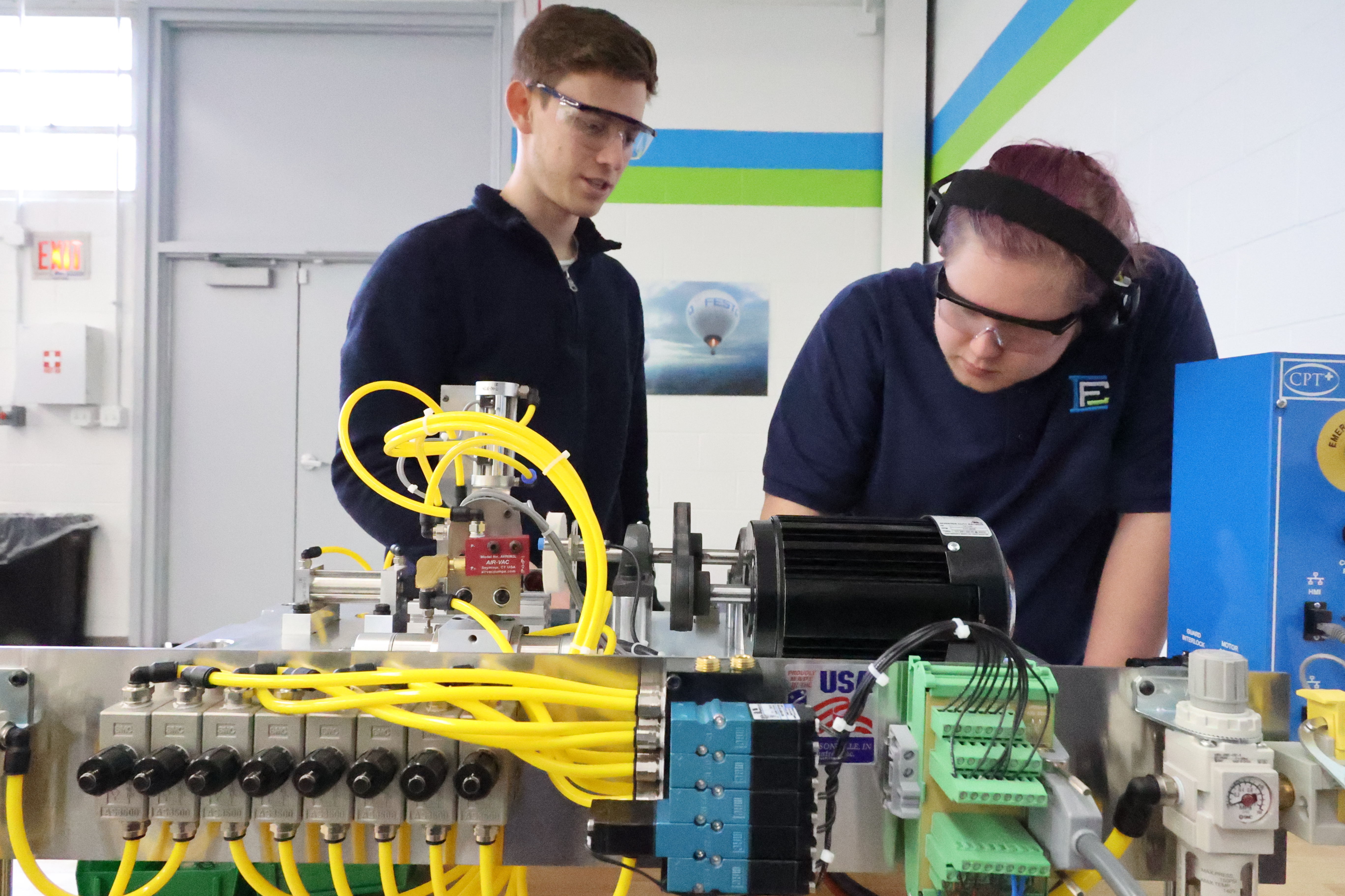 Instructor and student in the Robotics lab