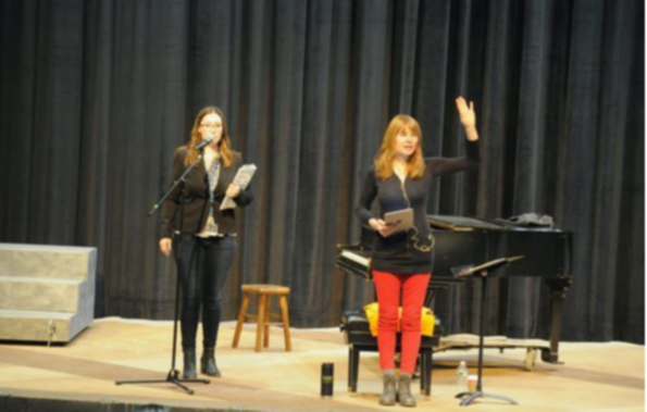 Female teacher and Female Singer Moira Smiley on Stage with Piano