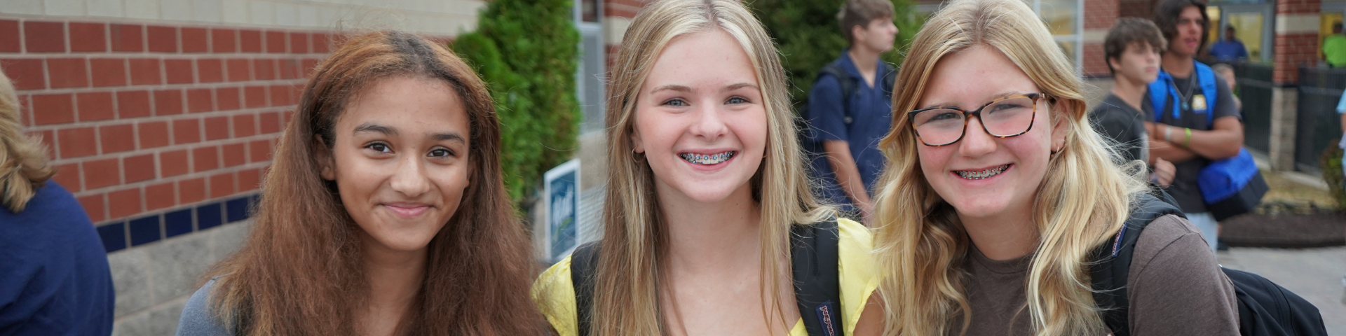 Three female students smiling