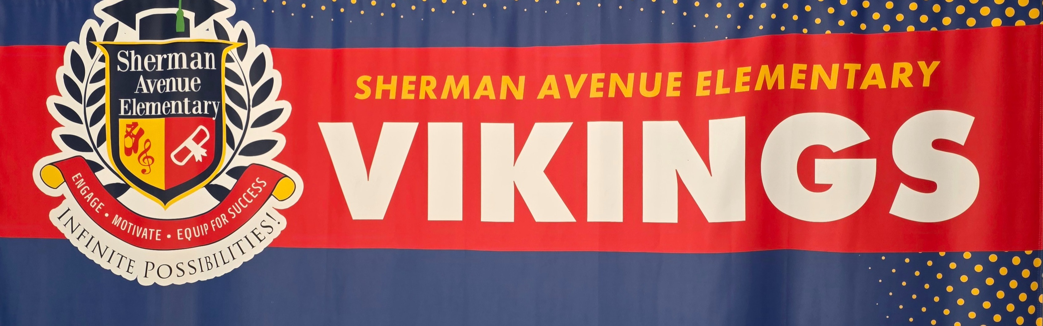 A blue backdrop displays the Sherman Avenue Elementary Vikings logo, featuring a shield with a deer head and the word "Vikings".