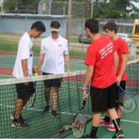 four tennis players on the court