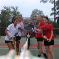 four tennis players on the court