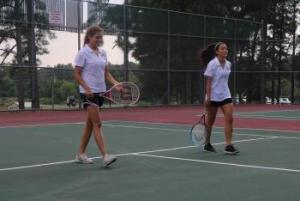 two tennis players on the court