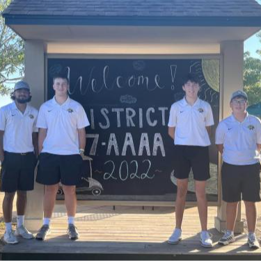 4 golf players taking a picture outside