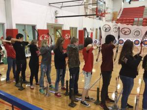 archery team with their bow and arrow