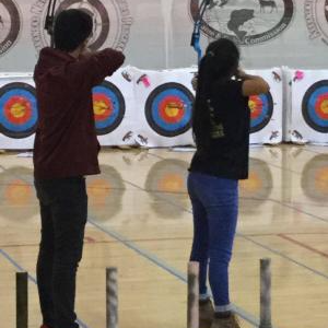 two people with their bow and arrow