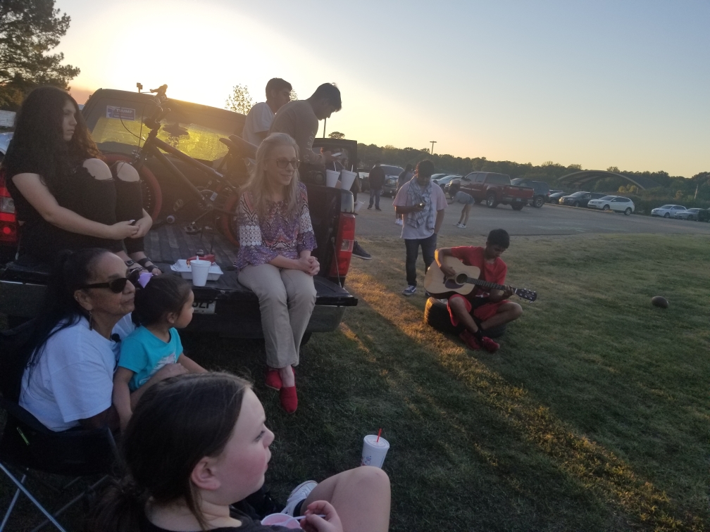 spanish club members sitting outside on truck