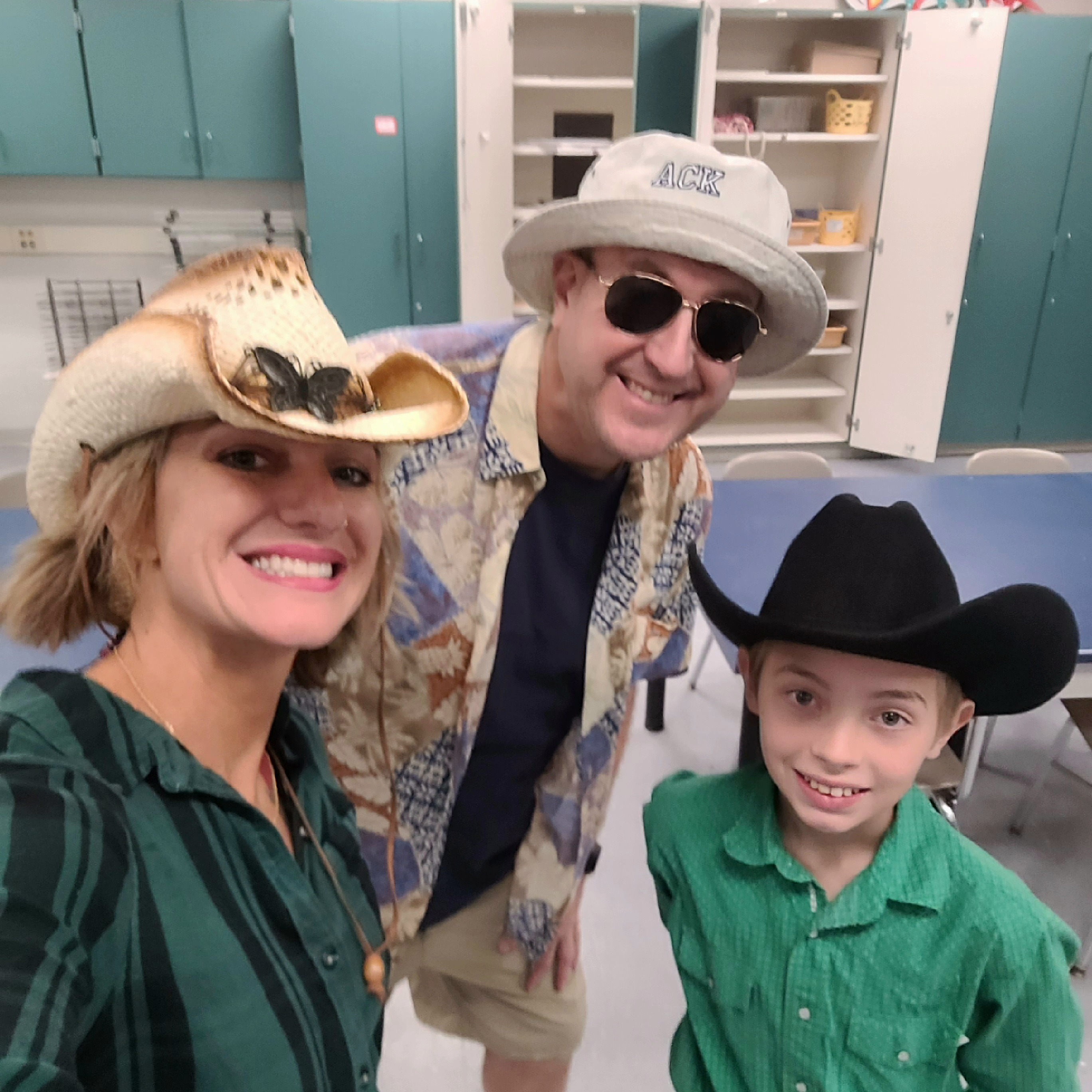 Mr. Gerycz and Mrs. Walland pose with a student for Spirit Week!
