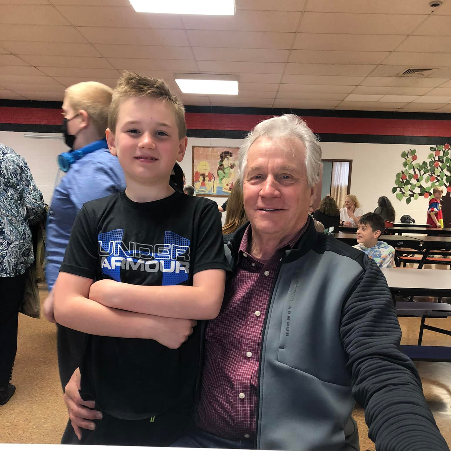 Sam R. takes a picture with his grandpa for Grandparents' Day.