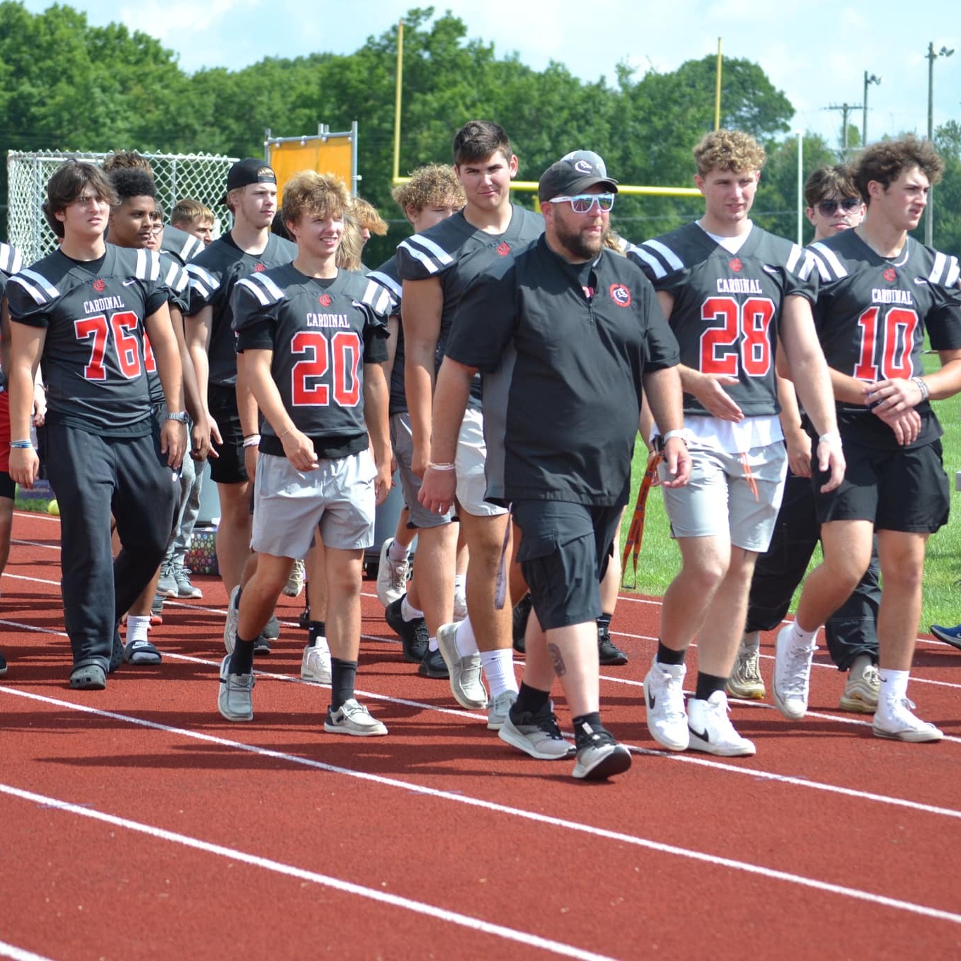 Coach Perrotti and the football team march in the Back-to-School Bash. 