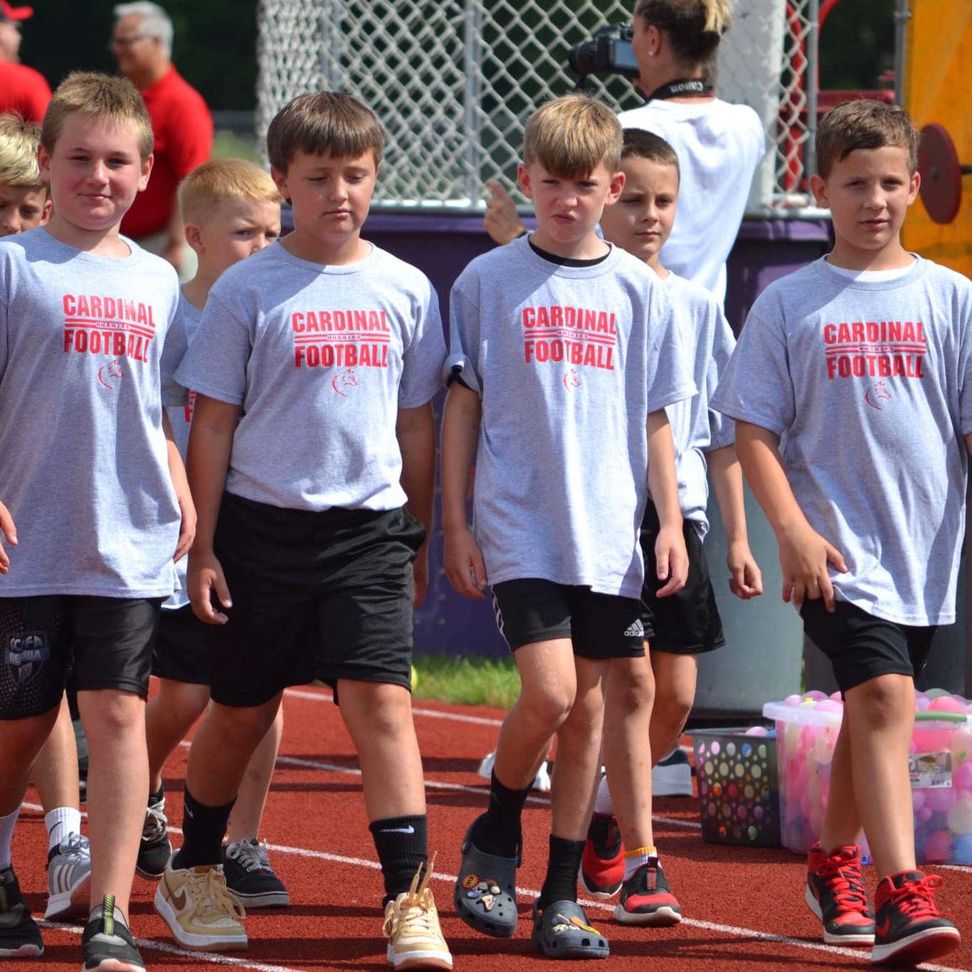 Youth football team participates in the Back-to-School Bash. 