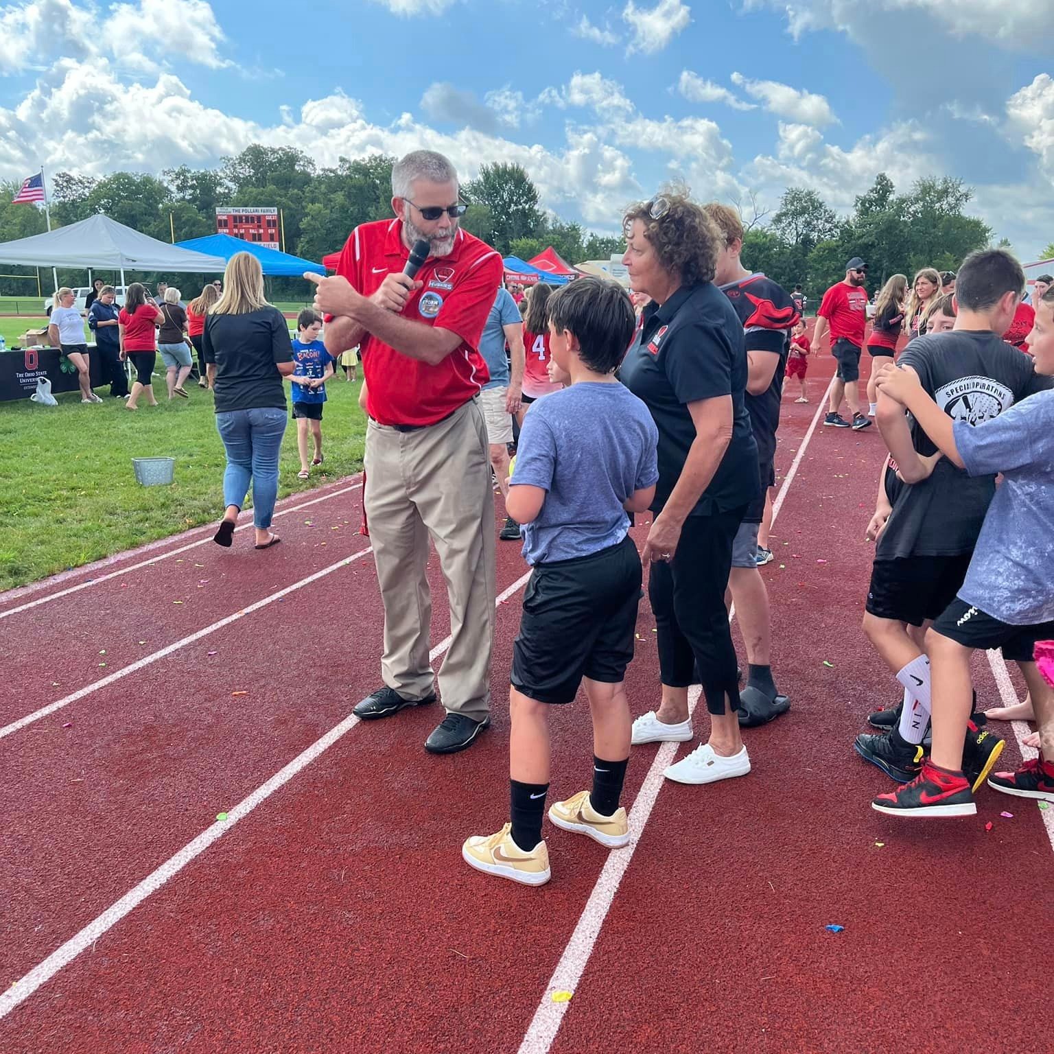 Mr. Cardinal speaks at the Back-to-School Bash. 