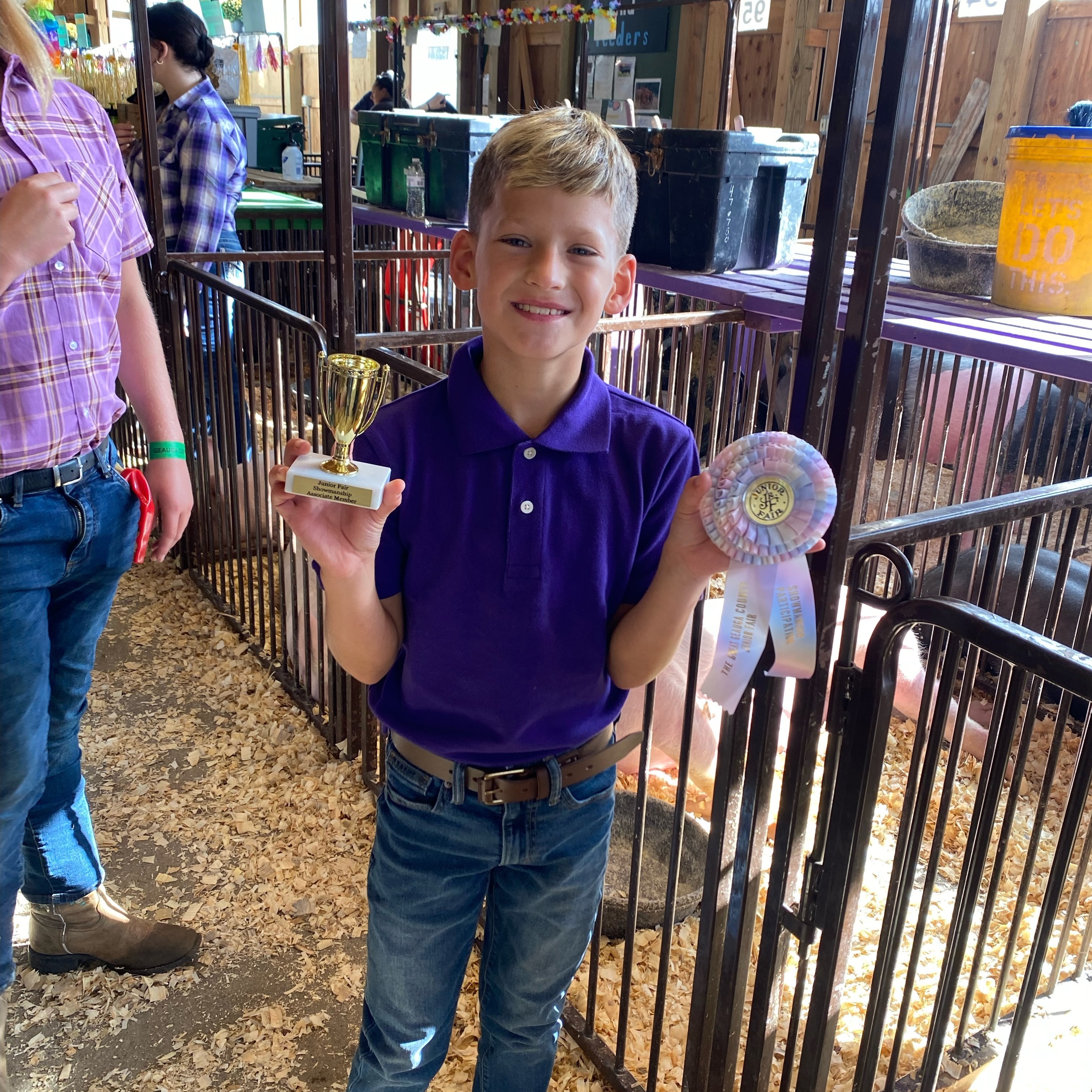 Ethan K. shows pigs at the Geauga County Fair. 