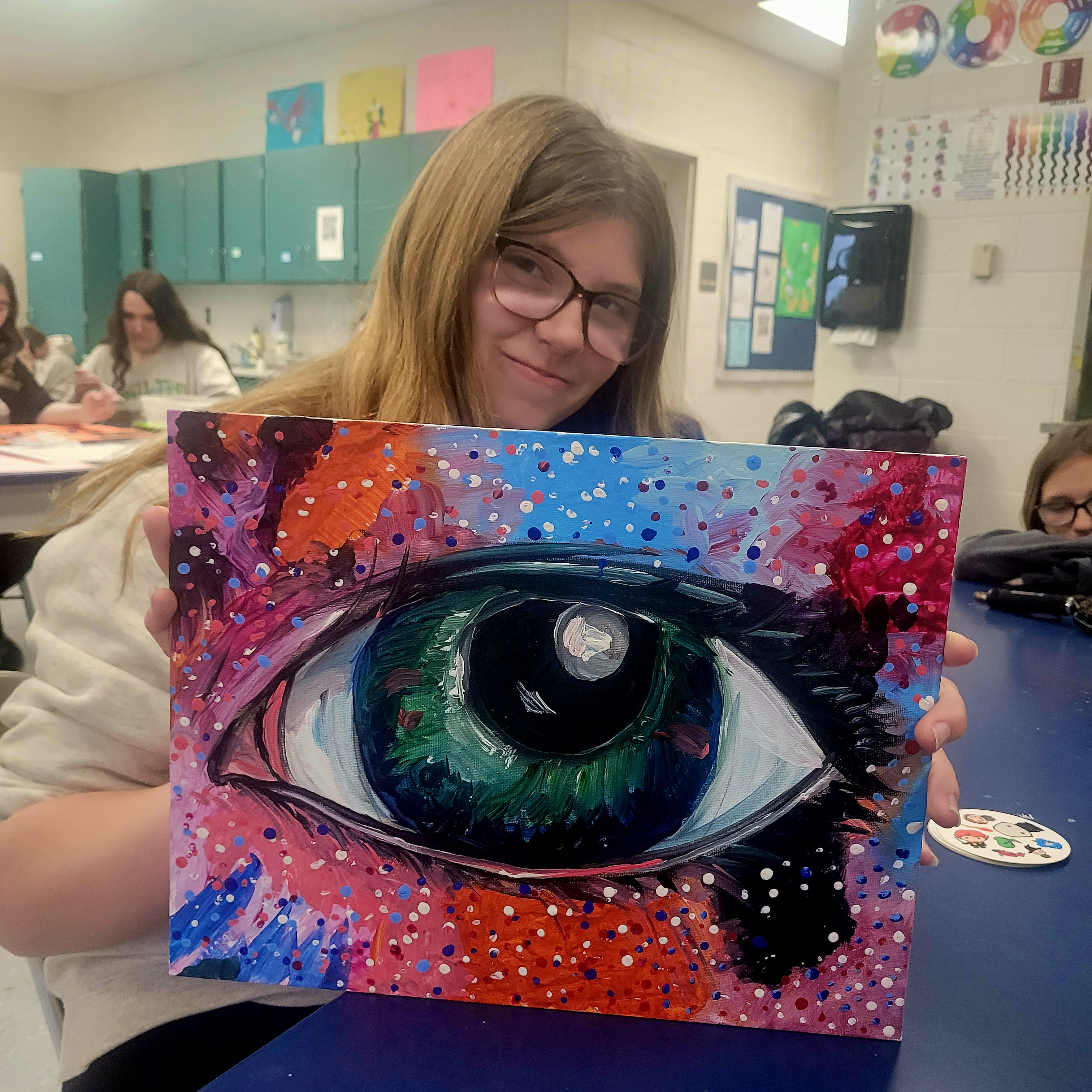 Avaryonna B. poses with one of her favorite art projects from last year. 