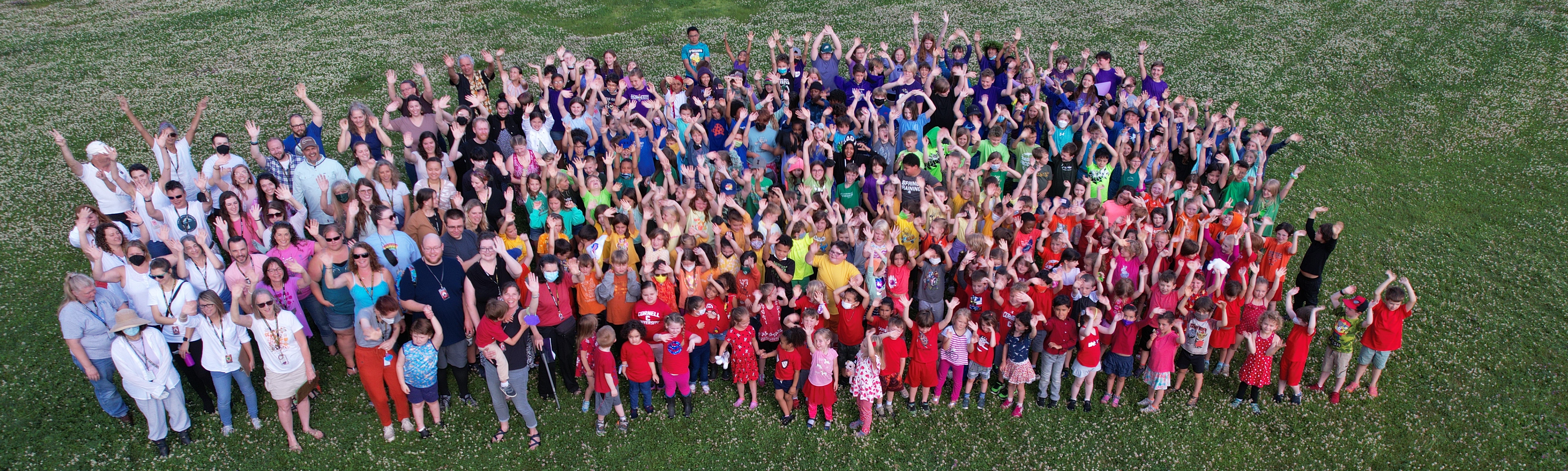 A picture of teachers and staff on the lawn. 