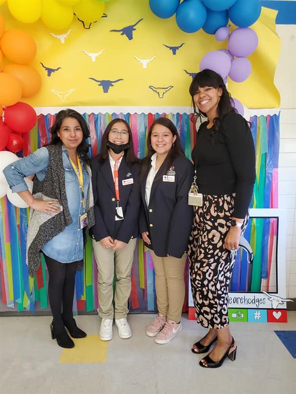 Teacher and students posing for photo